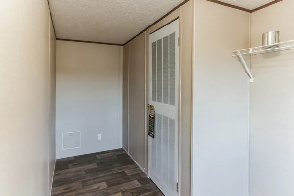 a view of dirt yard with large trees