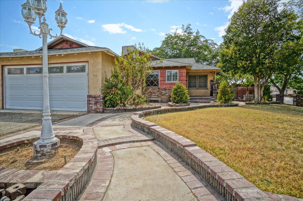 a view of house with yard