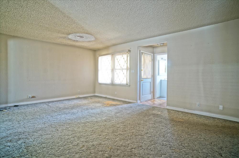 43879 Fig Avenue Lancaster, CA 93534 - Photo 4 of 11 a view of an empty room and window