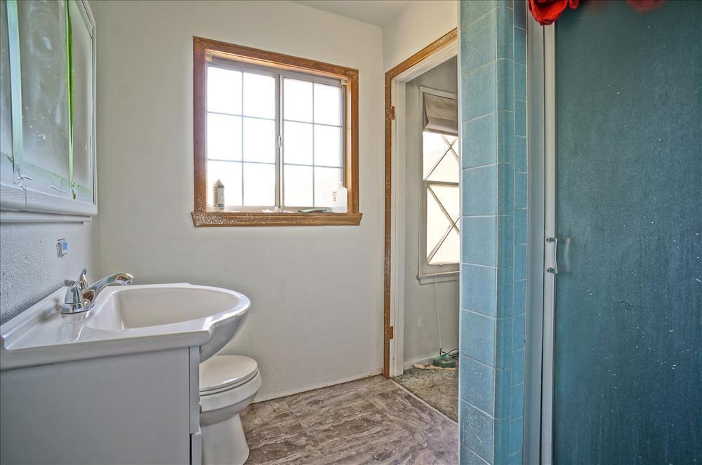 43879 Fig Avenue Lancaster, CA 93534 - Photo 6 of 11 a bathroom with a sink and a toilet