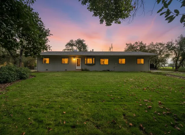 a view of a building with a yard