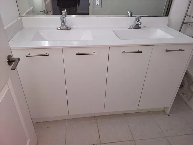 a bathroom with a sink and vanity