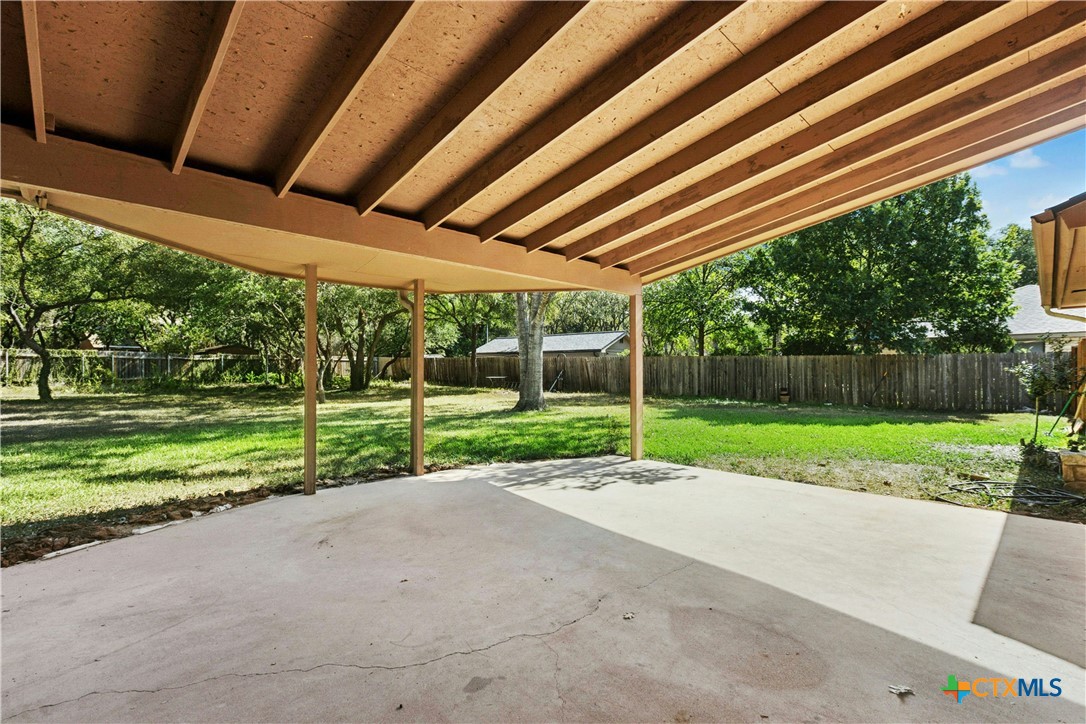 3502 Apache Forest Drive Austin, TX 78739 - Photo 11 of 34 a view of a backyard with wooden fence