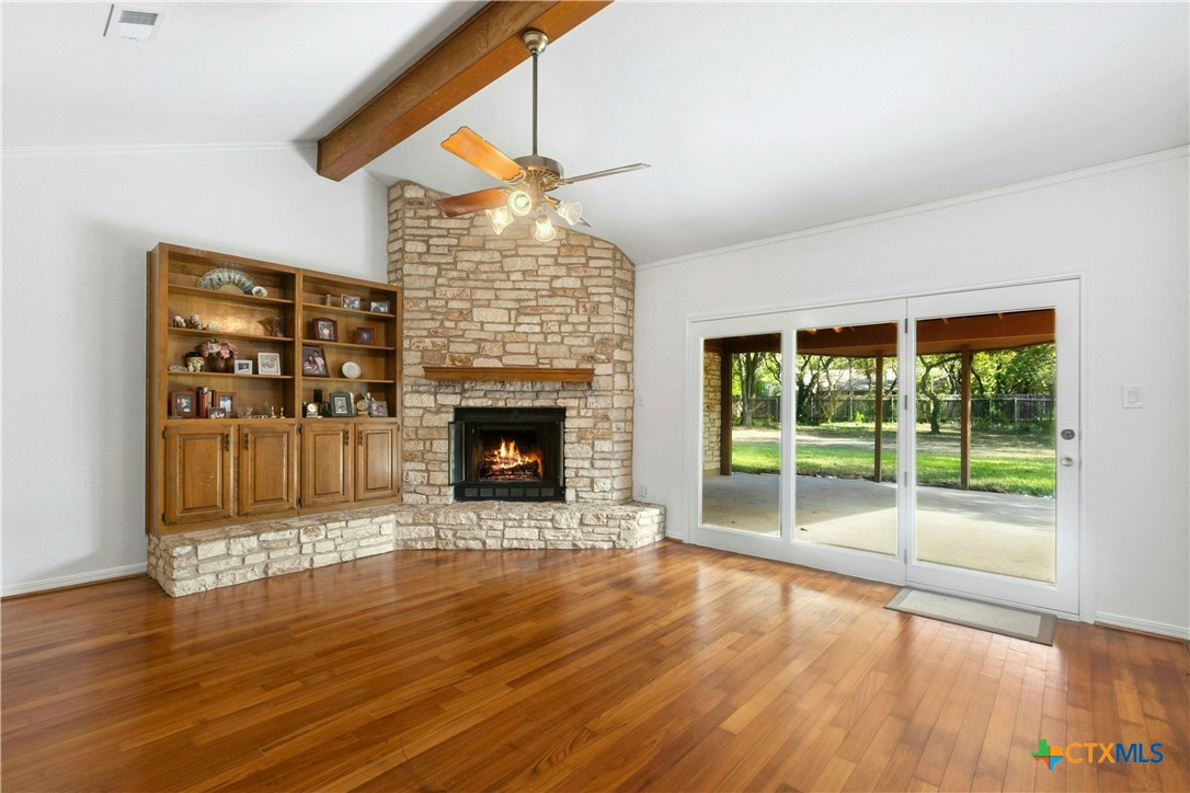 3502 Apache Forest Drive Austin, TX 78739 - Photo 13 of 34 a living room with furniture and a fireplace