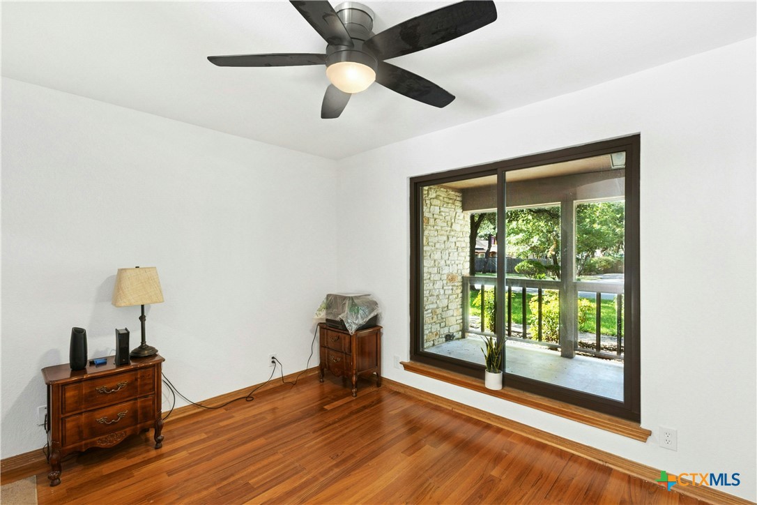3502 Apache Forest Drive Austin, TX 78739 - Photo 17 of 34 a view of room with window and wooden floor