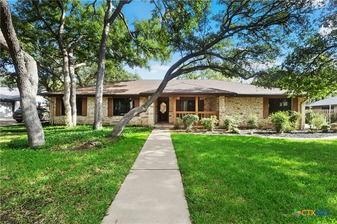 3502 Apache Forest Drive Austin, TX 78739 - Photo 2 of 34 a front view of a house with yard patio and green space