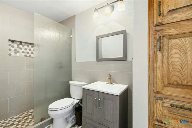 a bathroom with a sink and a toilet