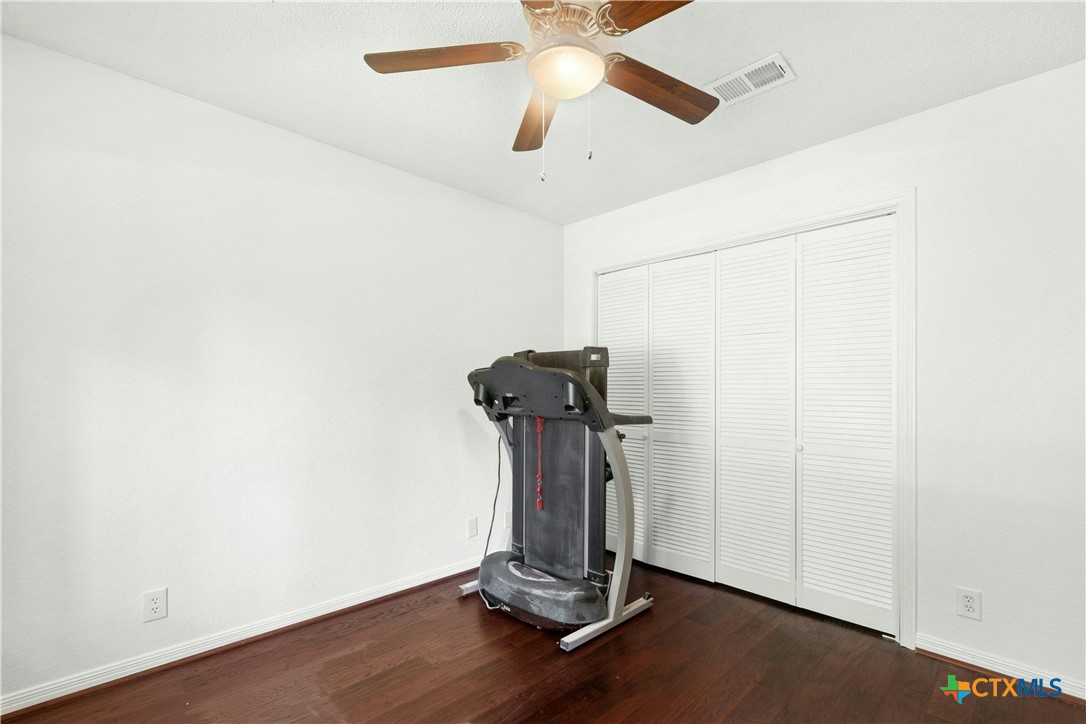 3502 Apache Forest Drive Austin, TX 78739 - Photo 32 of 34 a view of a room with gym equipment