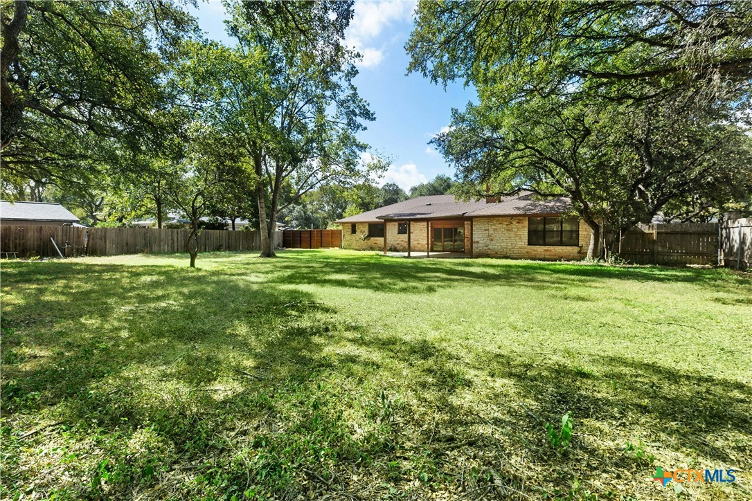 3502 Apache Forest Drive Austin, TX 78739 - Photo 9 of 34 a view of house with yard and green space