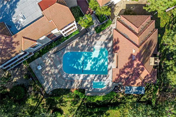 a view of a swimming pool with a lounge chairs