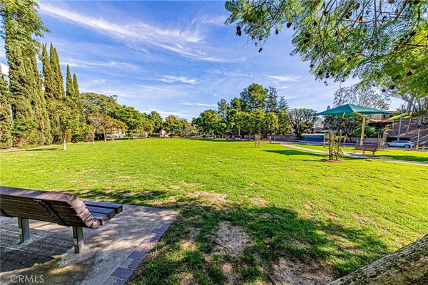 a view of a backyard with swimming pool