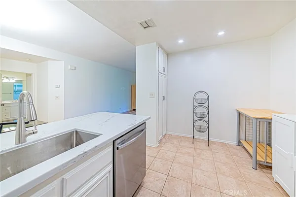 a view of a room that has a table and chairs in it