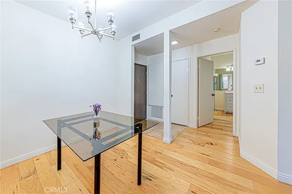 a spacious bathroom with a double vanity sink a large mirror a shower and bathtub