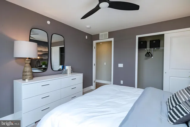 a bedroom with a large bed and a window