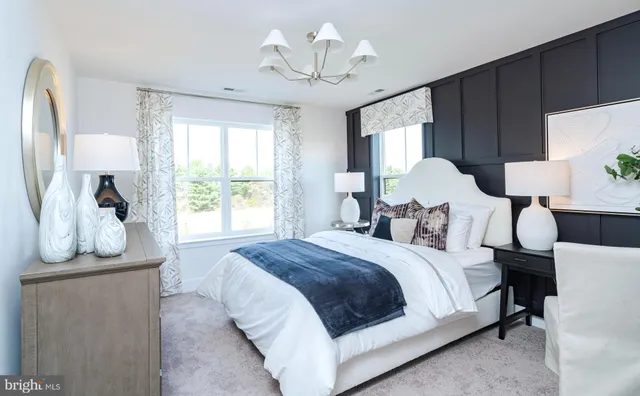 a bedroom with bed and a window