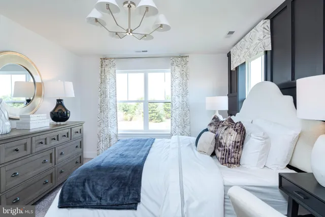 a front view of building with yard and green space