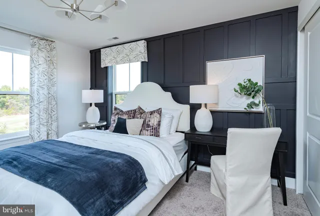 a front view of a building with a garden