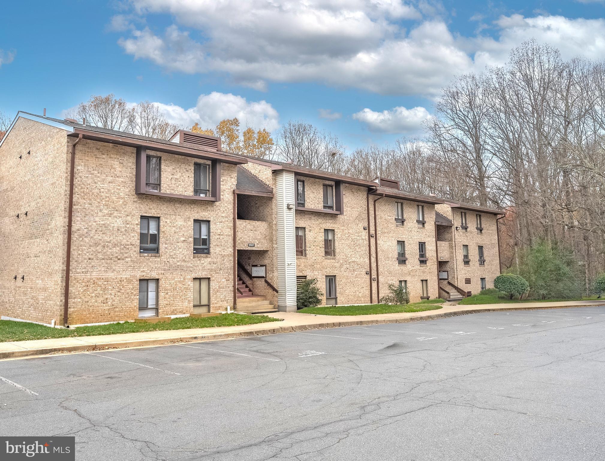 11657 Stoneview Square, Unit 97/22C Reston, VA 20191 - Photo 2 of 28 a view of a building with a street
