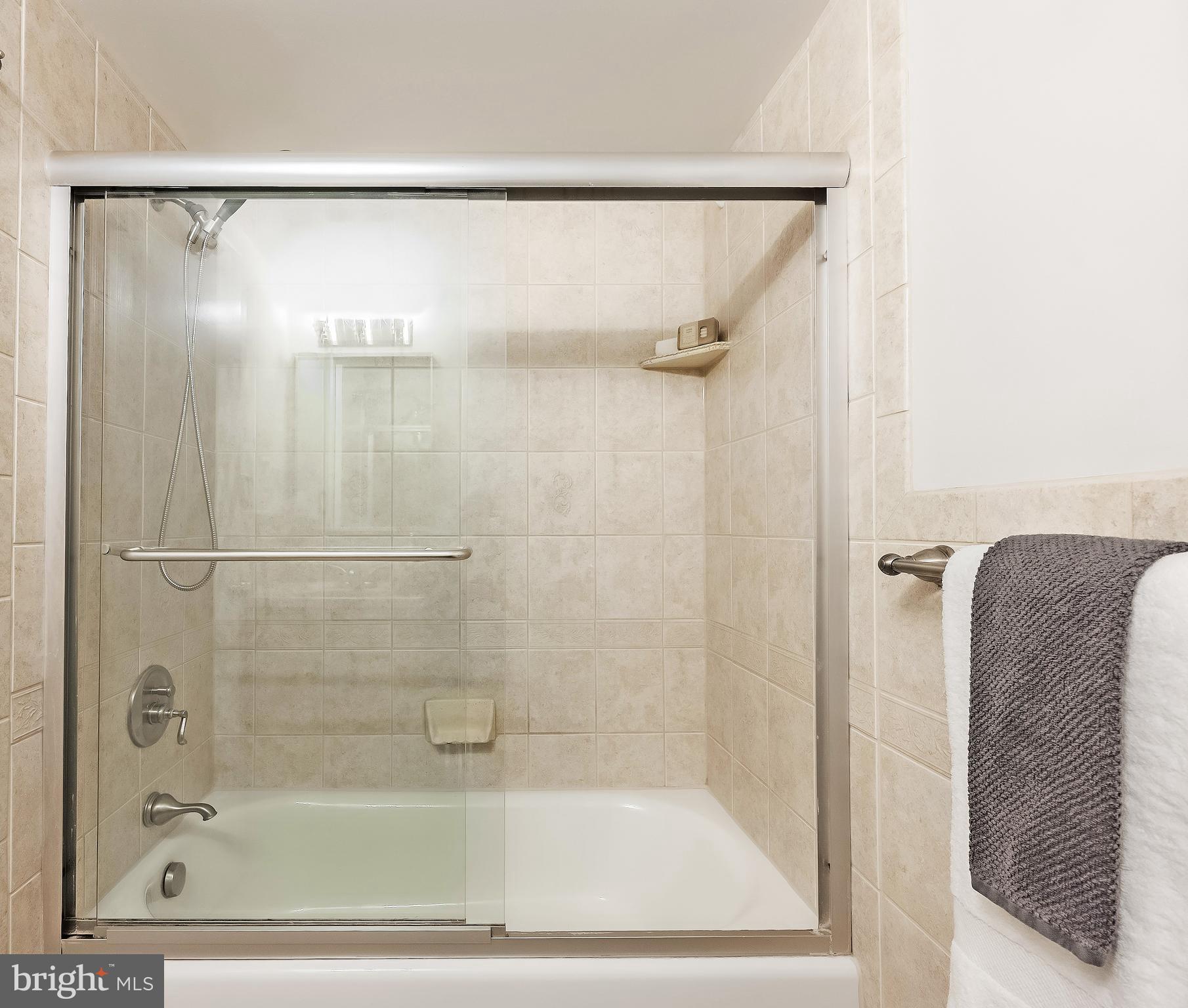 11657 Stoneview Square, Unit 97/22C Reston, VA 20191 - Photo 25 of 28 a bathroom with a shower