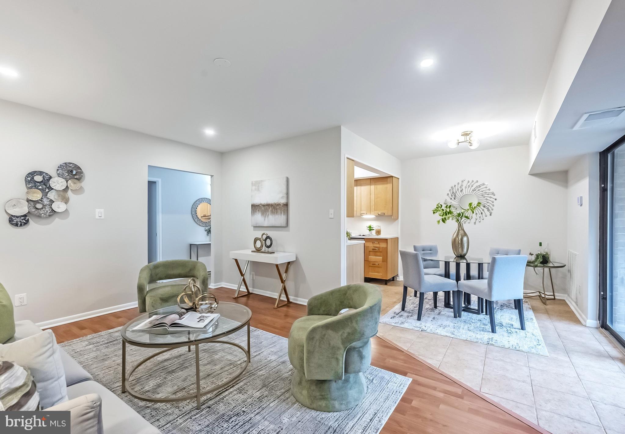 11657 Stoneview Square, Unit 97/22C Reston, VA 20191 - Photo 7 of 28 a living room with furniture and wooden floor
