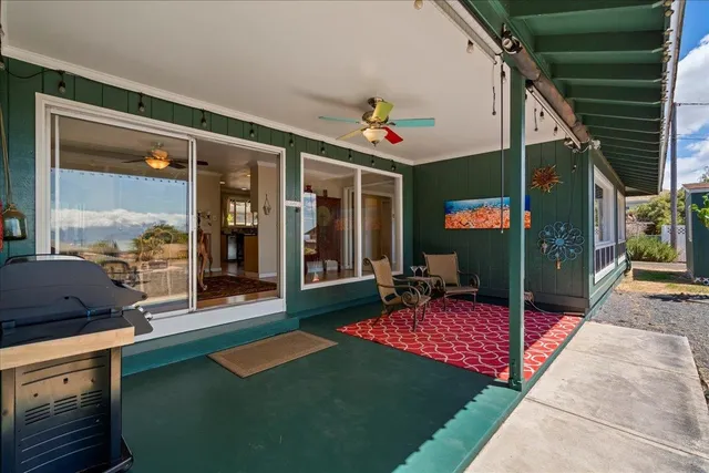 a view of an house with backyard porch and furniture