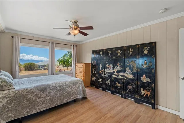 a bed room with a bed and a large window