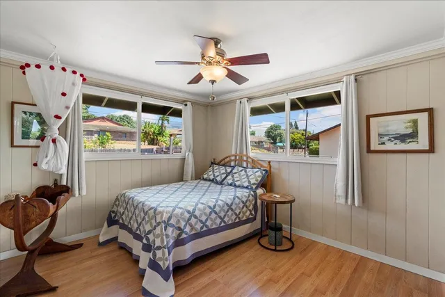 a bedroom with a bed dresser and a window
