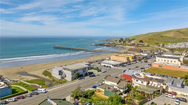 an aerial view of ocean and residential houses