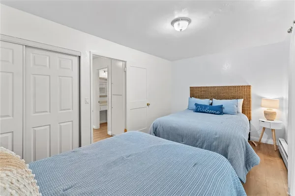 a bedroom with a bed and a lamp