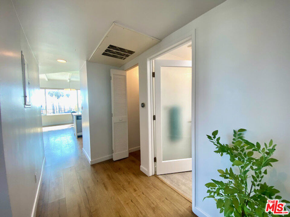 6824 Esplanade, Unit PH Playa del Rey, CA 90293 - Photo 16 of 20 a view of hallway with wooden floor