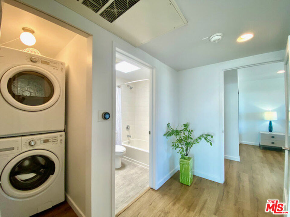 6824 Esplanade, Unit PH Playa del Rey, CA 90293 - Photo 6 of 20 a view of a hallway with washer and dryer