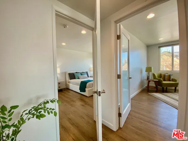 a view of a living room and a wooden floor