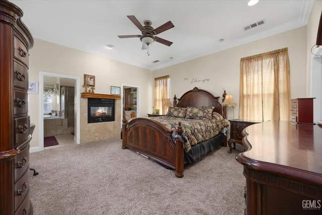 a bathroom with a granite countertop sink mirror and shower