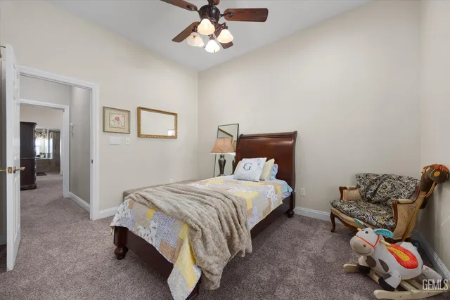 a bathroom with a shower curtain and a toilet