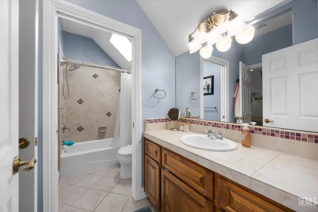 a view of a house with backyard sitting area and garden