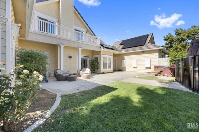 a view of kitchen with stainless steel appliances granite countertop cabinets and outdoor space