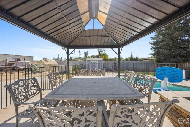 a large kitchen with a stove a sink dishwasher and a refrigerator