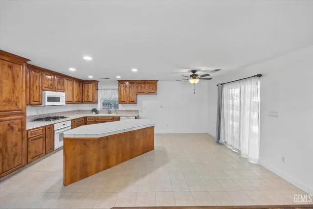 a view of an entryway with wooden floor and cabinet