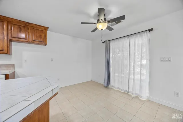 an aerial view of a house with outdoor seating