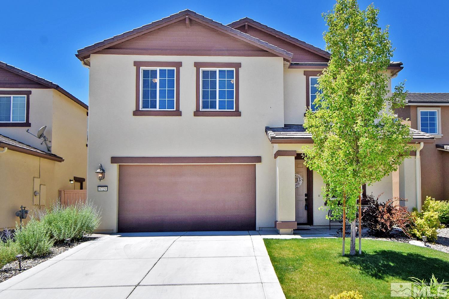 9729 Pachuca Drive Reno, NV 89521 - Photo 1 of 40 a front view of a house with a yard