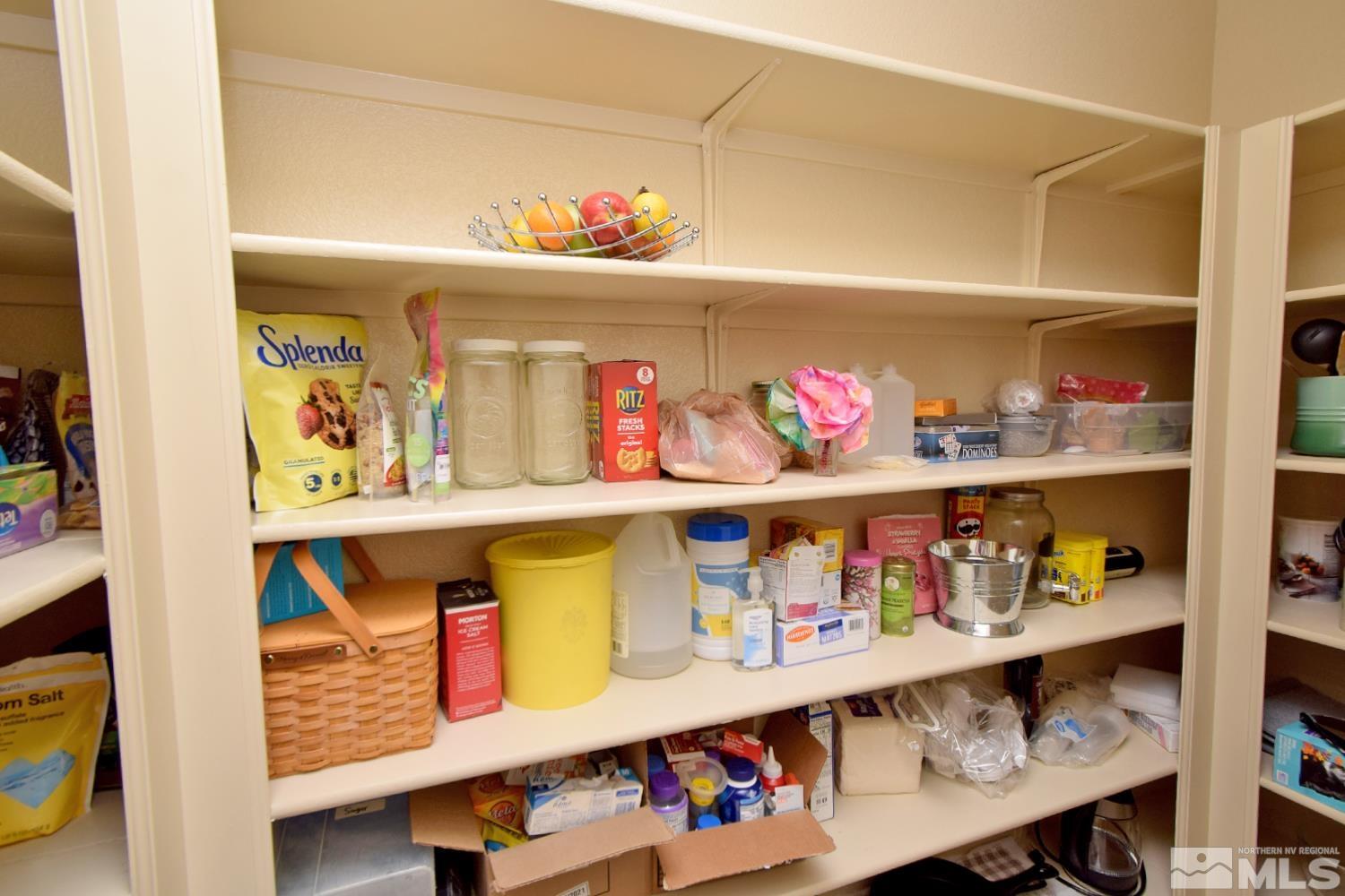 9729 Pachuca Drive Reno, NV 89521 - Photo 13 of 40 a store room with lots of clutter and flowers on the wall