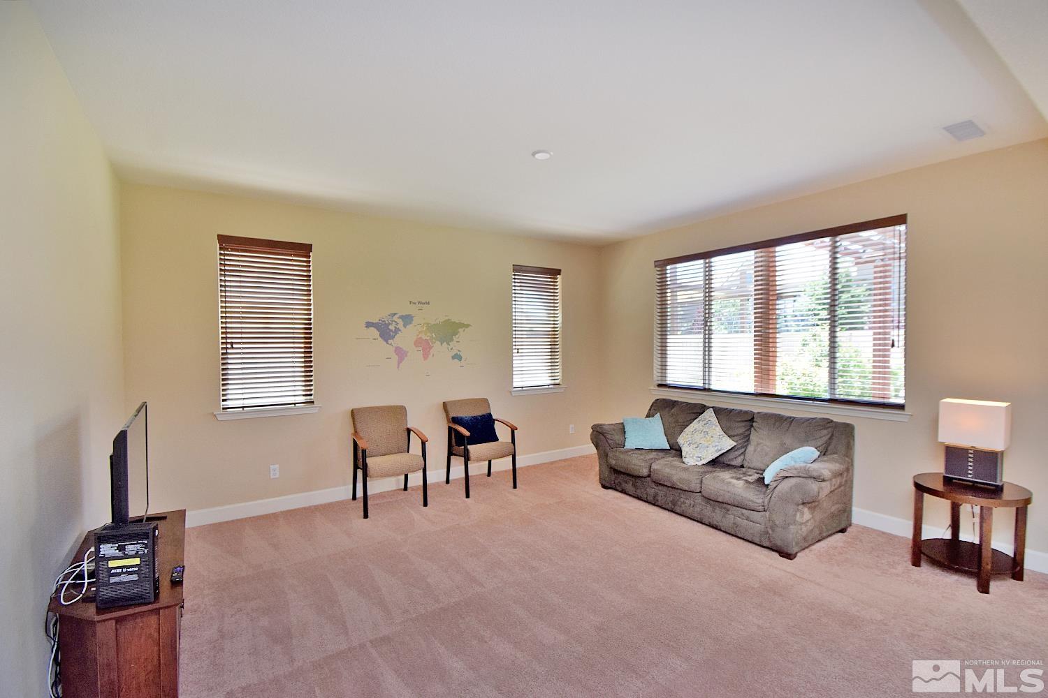 9729 Pachuca Drive Reno, NV 89521 - Photo 15 of 40 a living room with furniture and a window