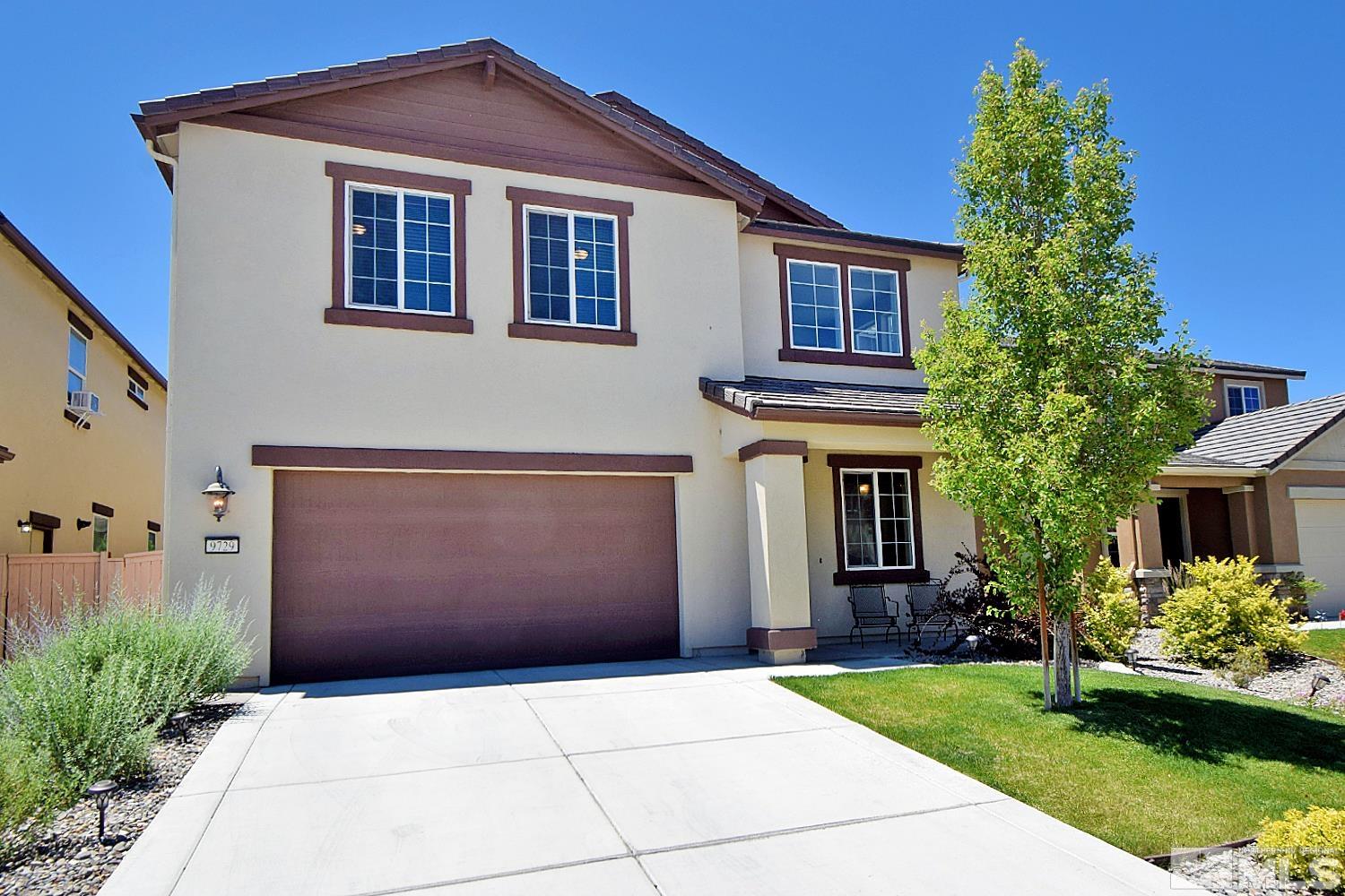 9729 Pachuca Drive Reno, NV 89521 - Photo 2 of 40 a front view of a house with a yard