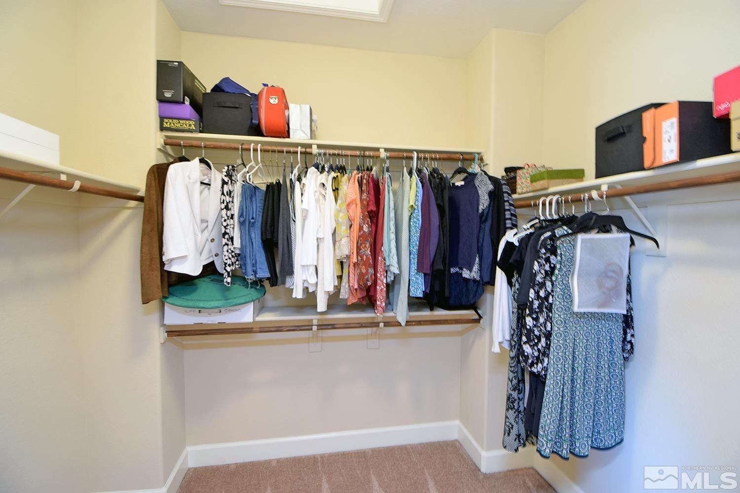 9729 Pachuca Drive Reno, NV 89521 - Photo 25 of 40 a view of walk in closet with clothes and shoes