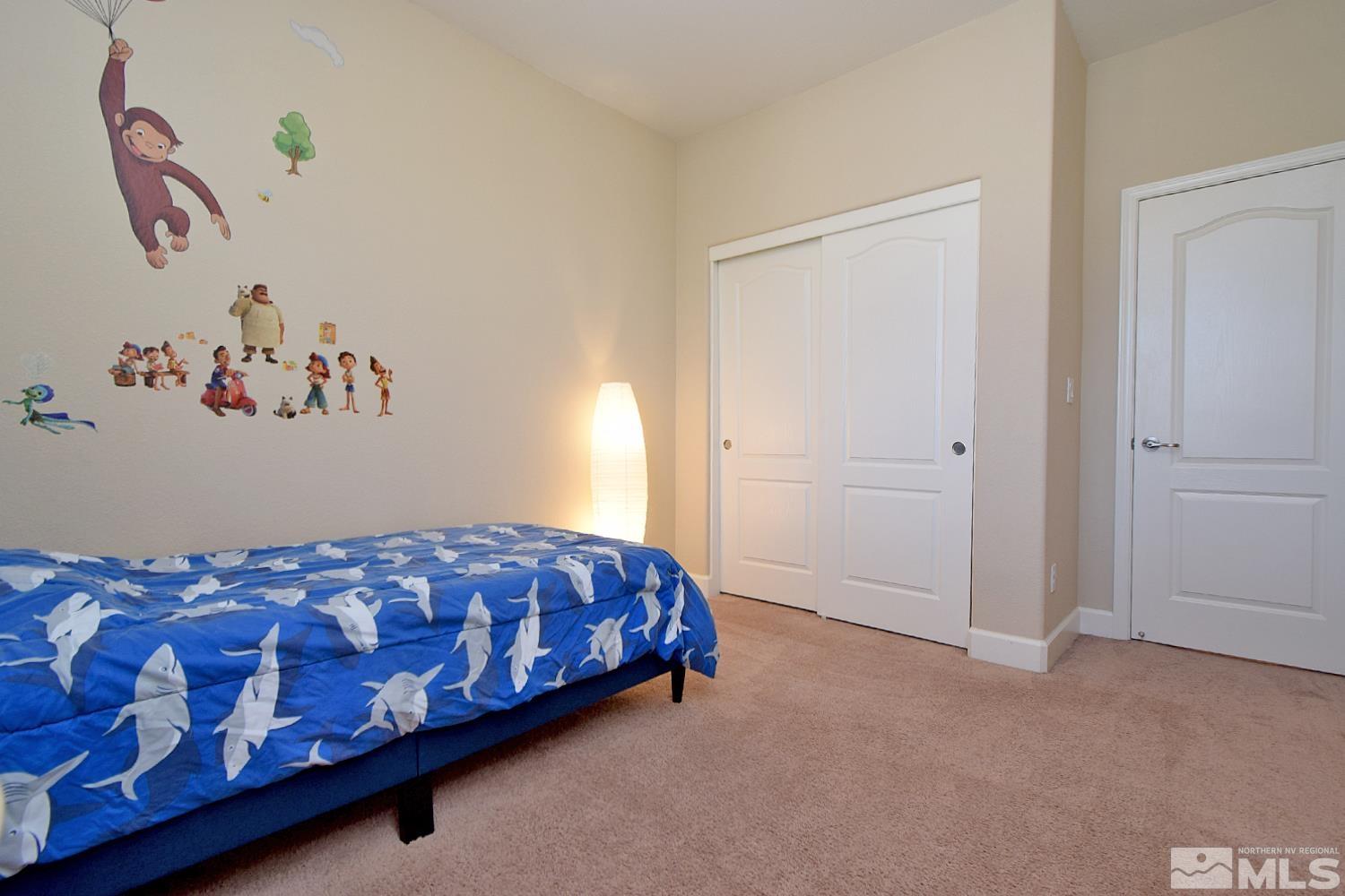 9729 Pachuca Drive Reno, NV 89521 - Photo 30 of 40 a bedroom with a bed and a window