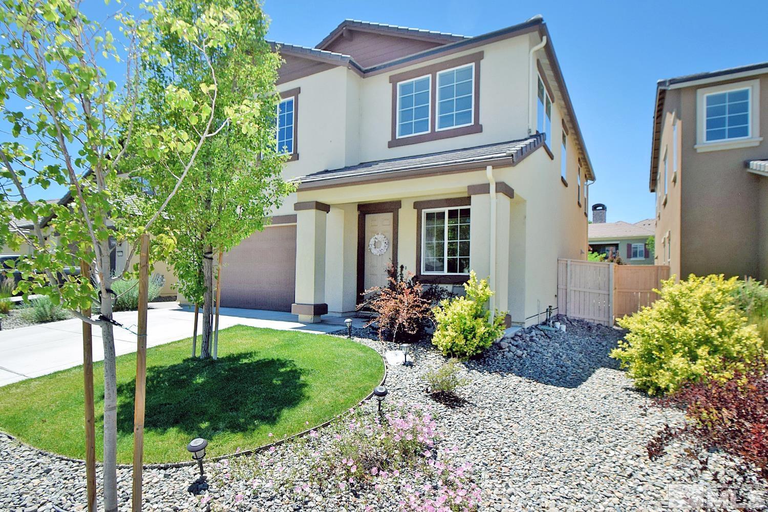 9729 Pachuca Drive Reno, NV 89521 - Photo 3 of 40 a view of a house with backyard and garden