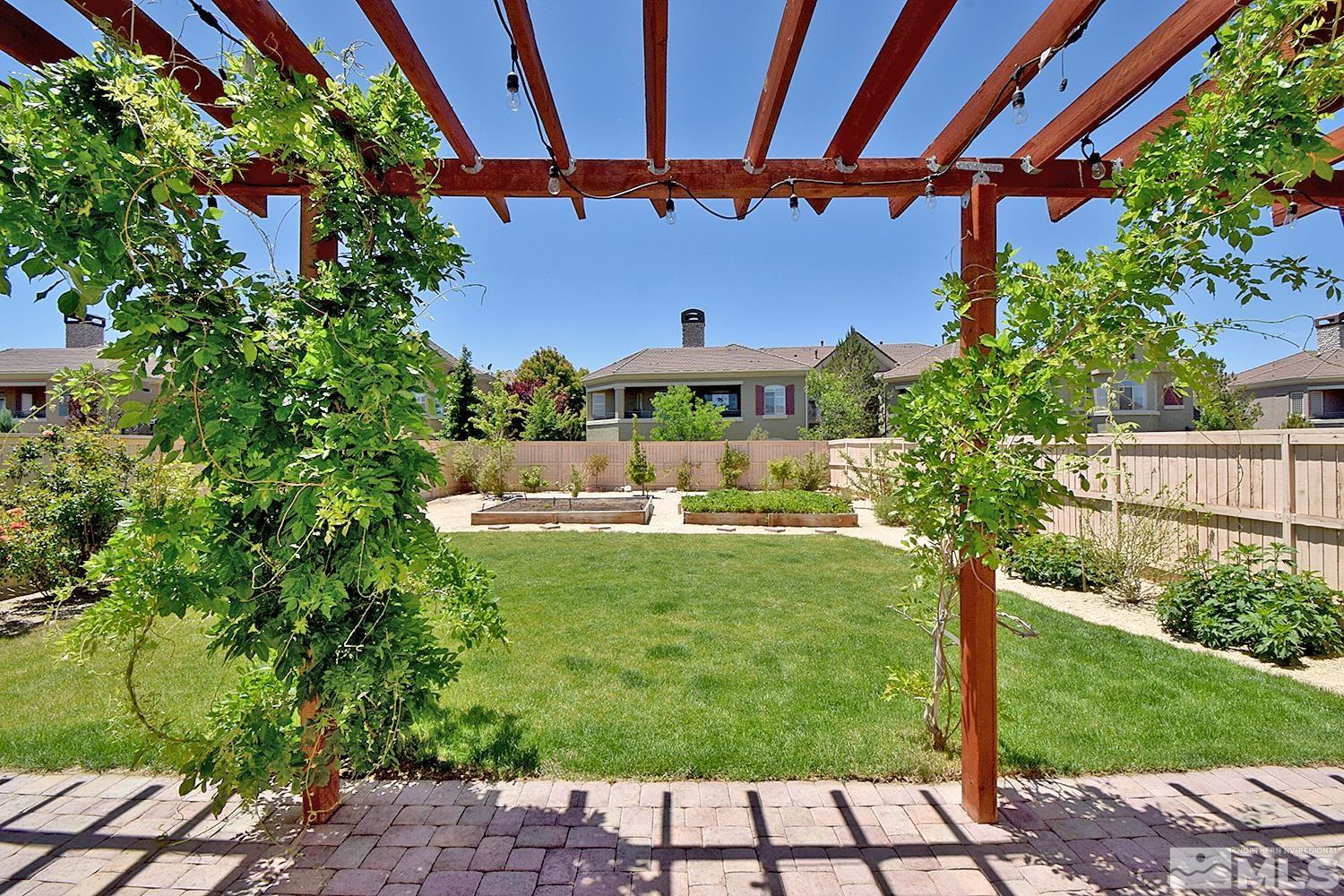 9729 Pachuca Drive Reno, NV 89521 - Photo 34 of 40 a view of a swimming pool with a yard