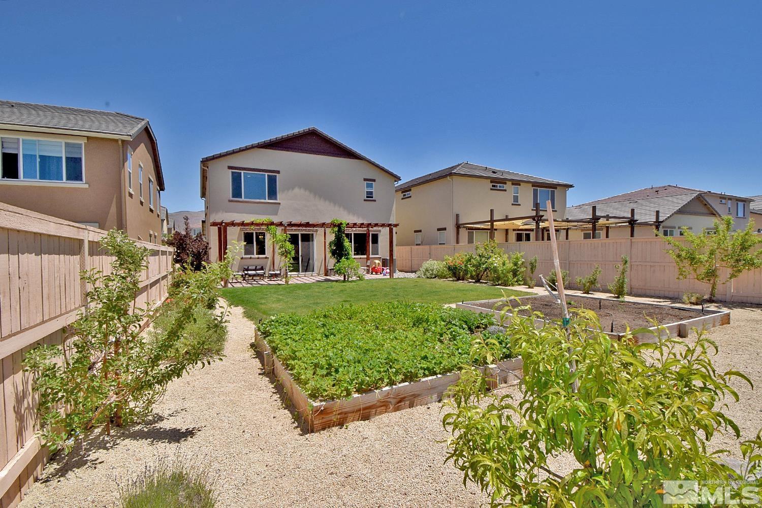 9729 Pachuca Drive Reno, NV 89521 - Photo 40 of 40 a front view of a house with a yard