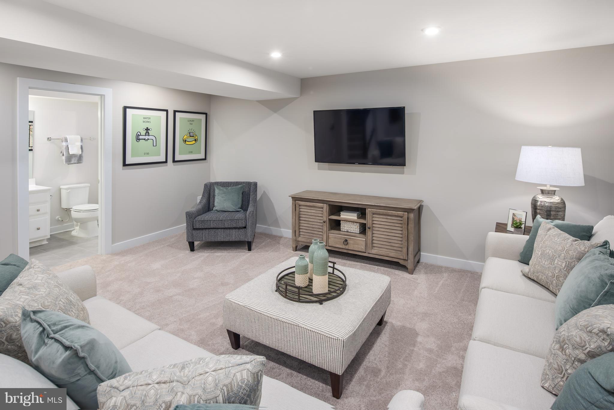 1242 Upper Patuxent Ridge Road Odenton, MD 21113 - Photo 13 of 31 a living room with furniture and a flat screen tv