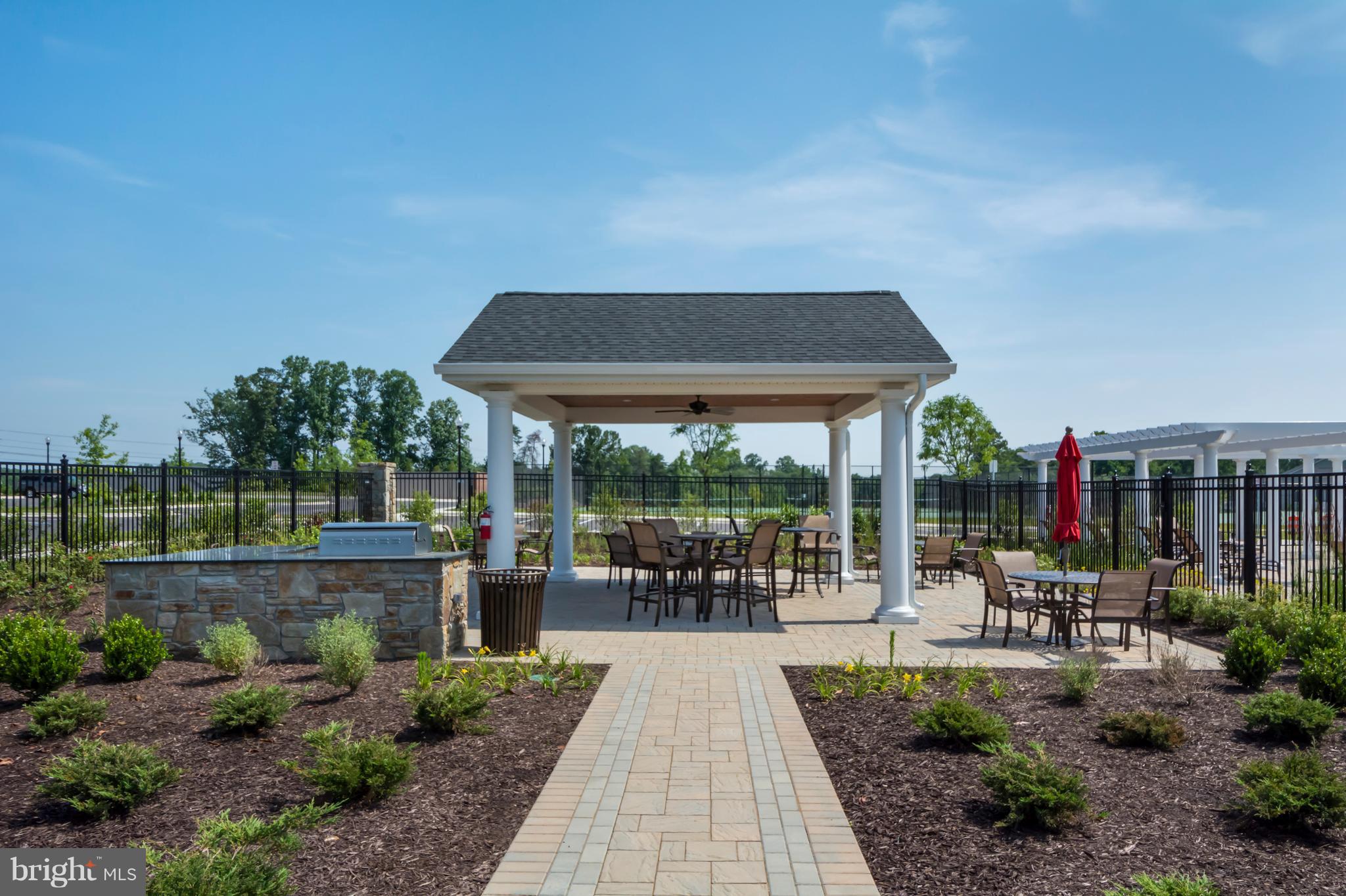 1242 Upper Patuxent Ridge Road Odenton, MD 21113 - Photo 15 of 31 a patio with table and chairs